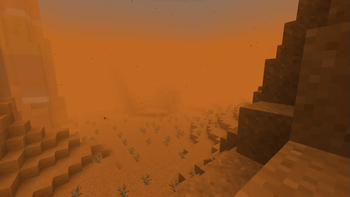 A foggy sandstorm in a badlands.