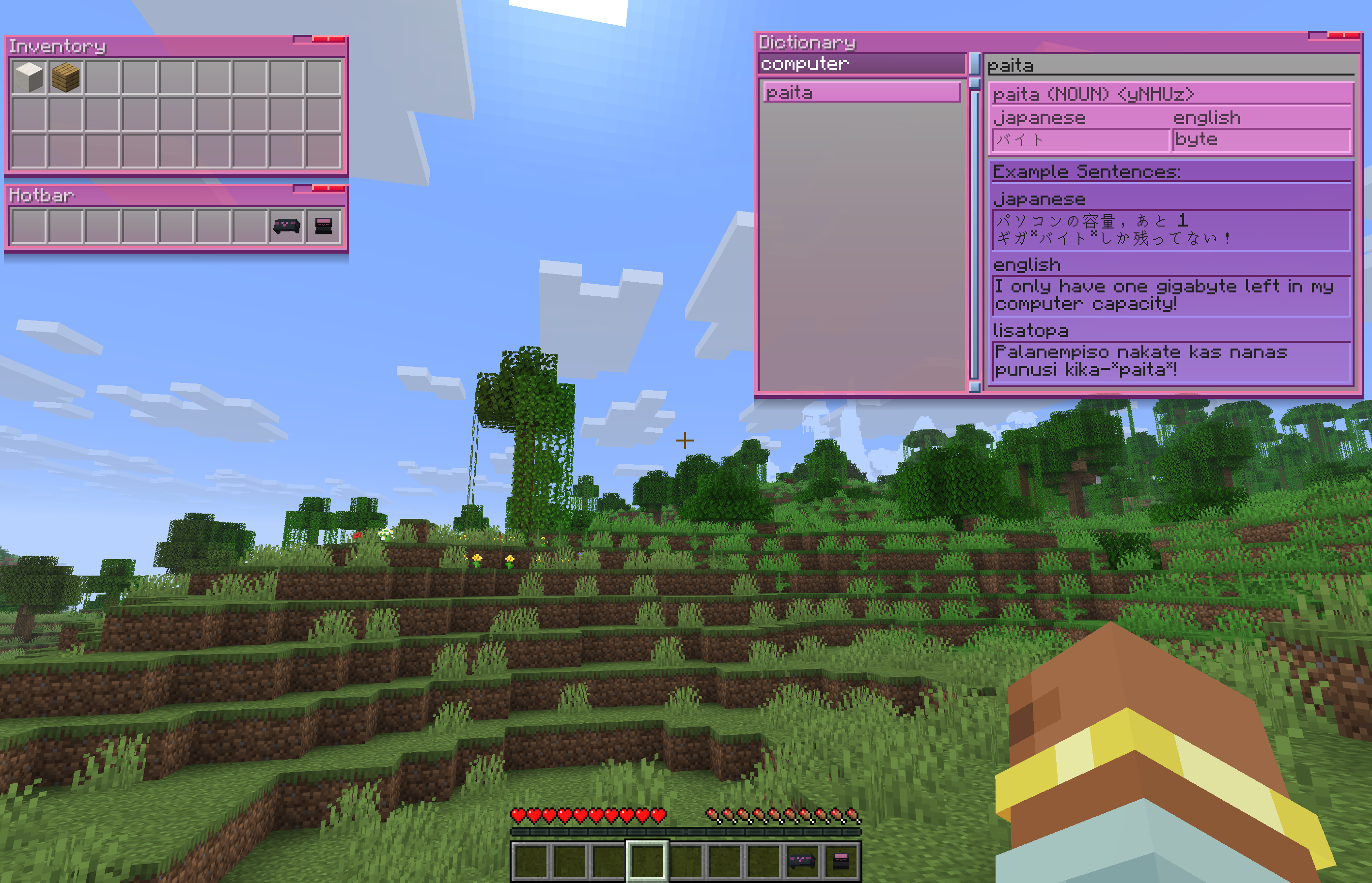 A normal minecraft screenshot, but with additional information displayed on the HUD. The screenshot isn't in front of a block providing said UI elements, it's of the player on a walk outside. There are three windows, two of them are a view of the inventory, and of the hotbar. A third window is a dictionary, with 'computer' typed in the search bar (in this case, searching example sentences), the only result being the Lisatopan word 'paita' - showing the translation of said word into 'byte', the search having found the example sentence shown underneath that of 'I only have one gigabyte left in my computer capacity', linked to the Lisatopan transliteration of 'Palanempiso nakate kas nanas punusi kika-paita'. The HeadStele and TabSlate icons are in the player's hotbar.