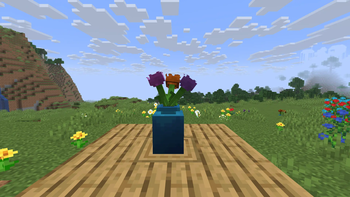 Vase with three rose cuttings inside