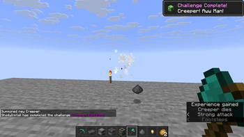 The advancement triggering upon killing a Creeper