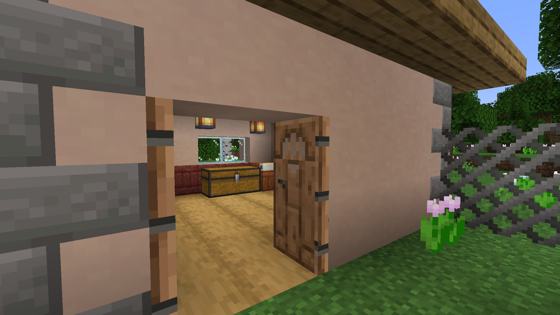 House with trims, quoins, decomod doors, a wallpapering table, and a chain-link fence