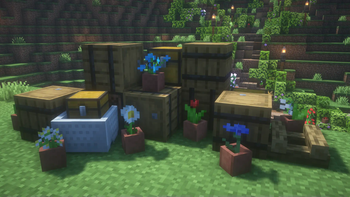 Pile of barrels and chests, with potted flowers around