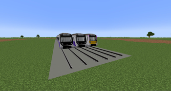 Three different train stocks standing at a siding.