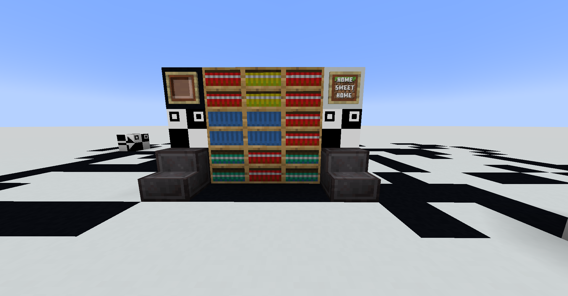 A screenshot from a superflat world made entirely of white concrete. Prominently featured are the Box of Infinite Books, Cursor, A Very Fine Item, An Ant, Footprint, and Netherite Stairs from 20w14infinite. In the background, two An Ant blocks are changing white concrete blocks into black concretes.