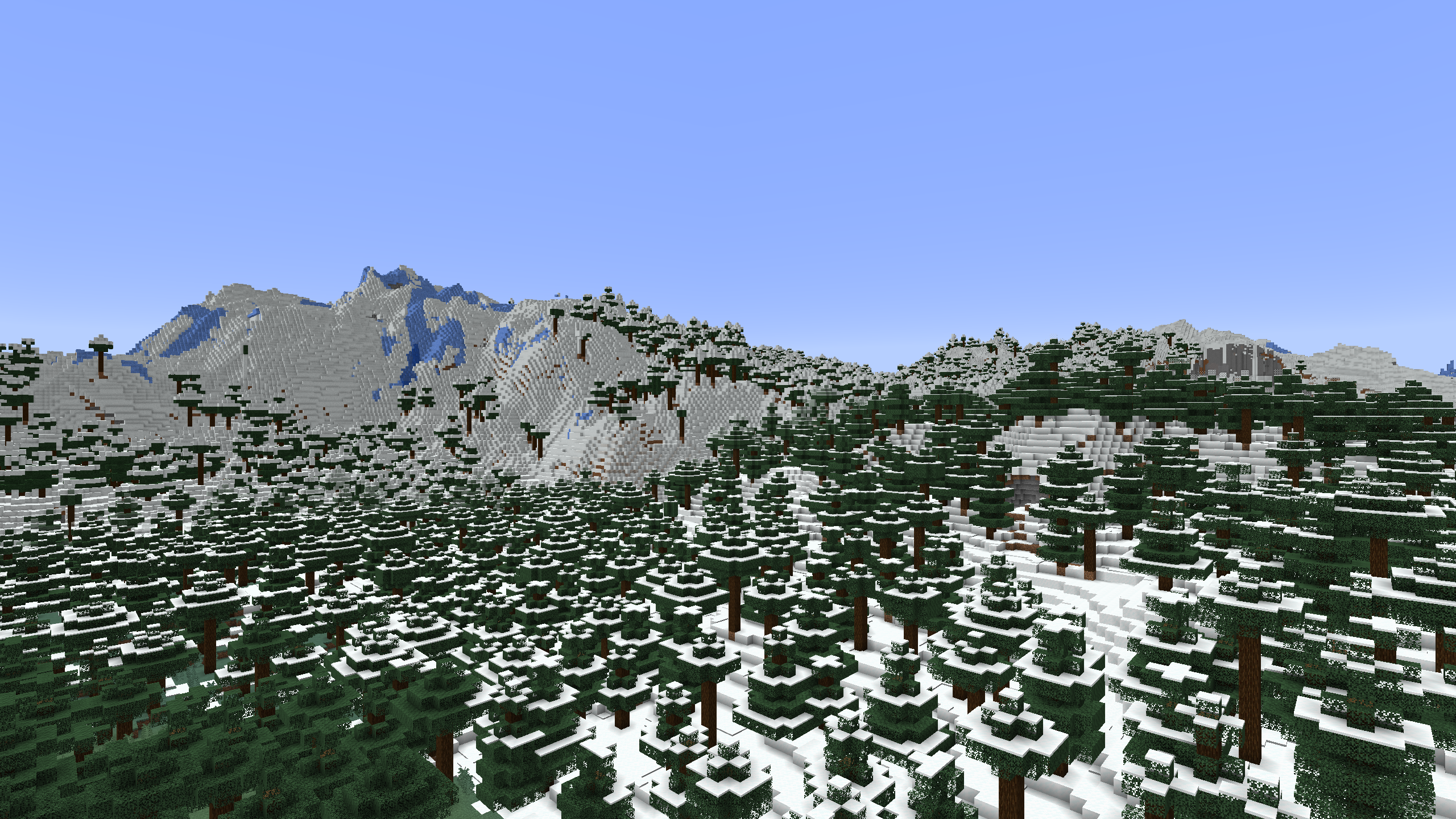 A Frozen Peaks mountain range surrounded by lots of snow and taiga trees
