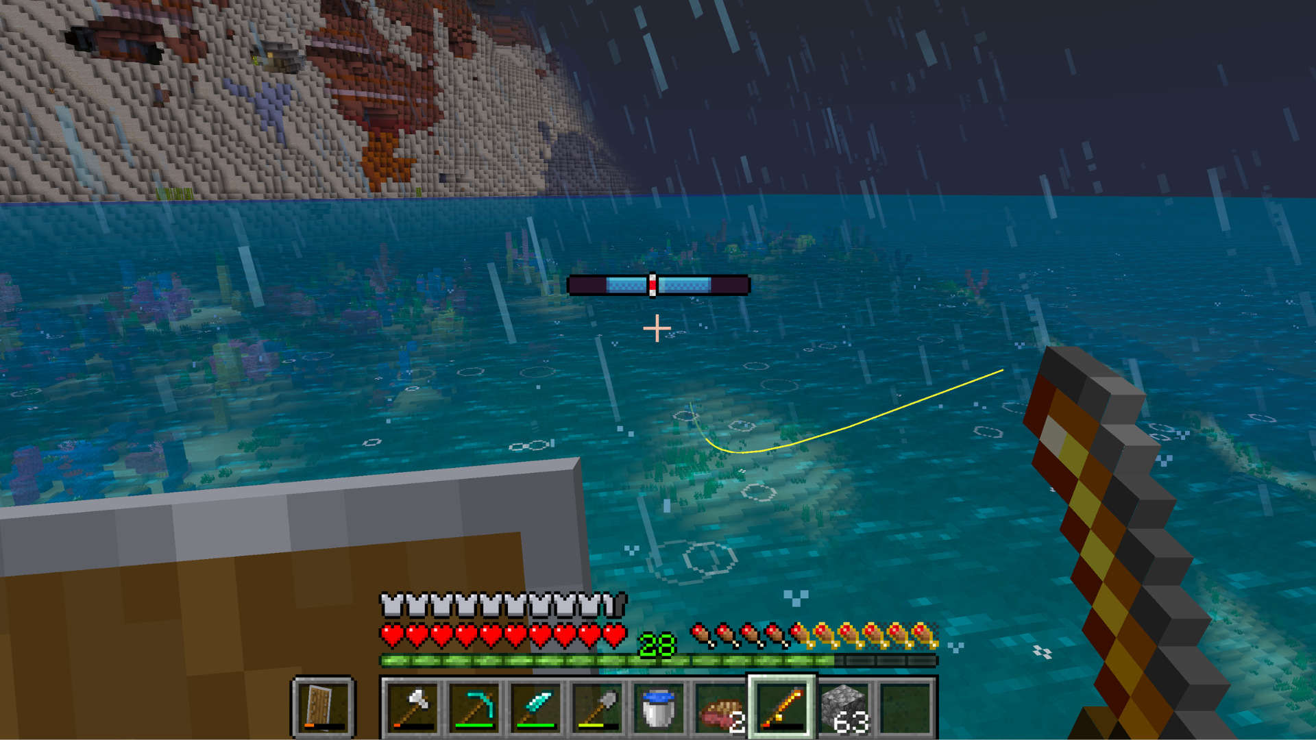Someone fishing in the rain at dusk with a golden fishing rod, with a large island in the background.