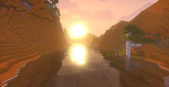 The sun bouncing on a river in a canyon