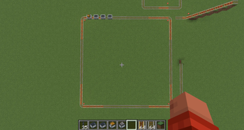Linked minecarts moving in sync on a square track