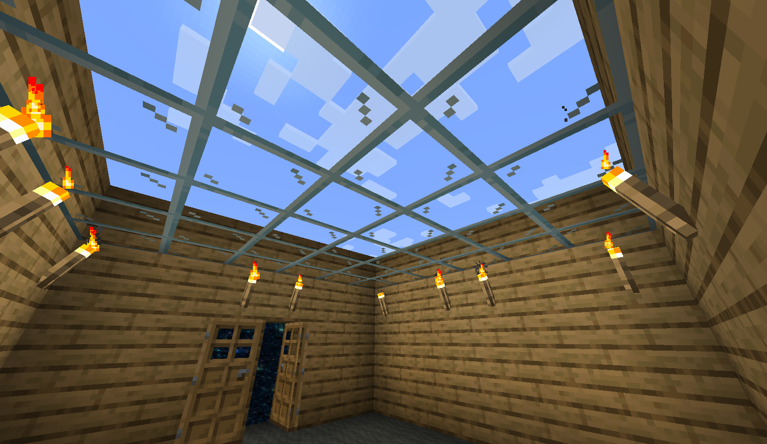 A simple wooden house with a glass ceiling revealing a sky - or a false sky made of Blocks of Sky! A door leading to the void can also be seen on the wall.