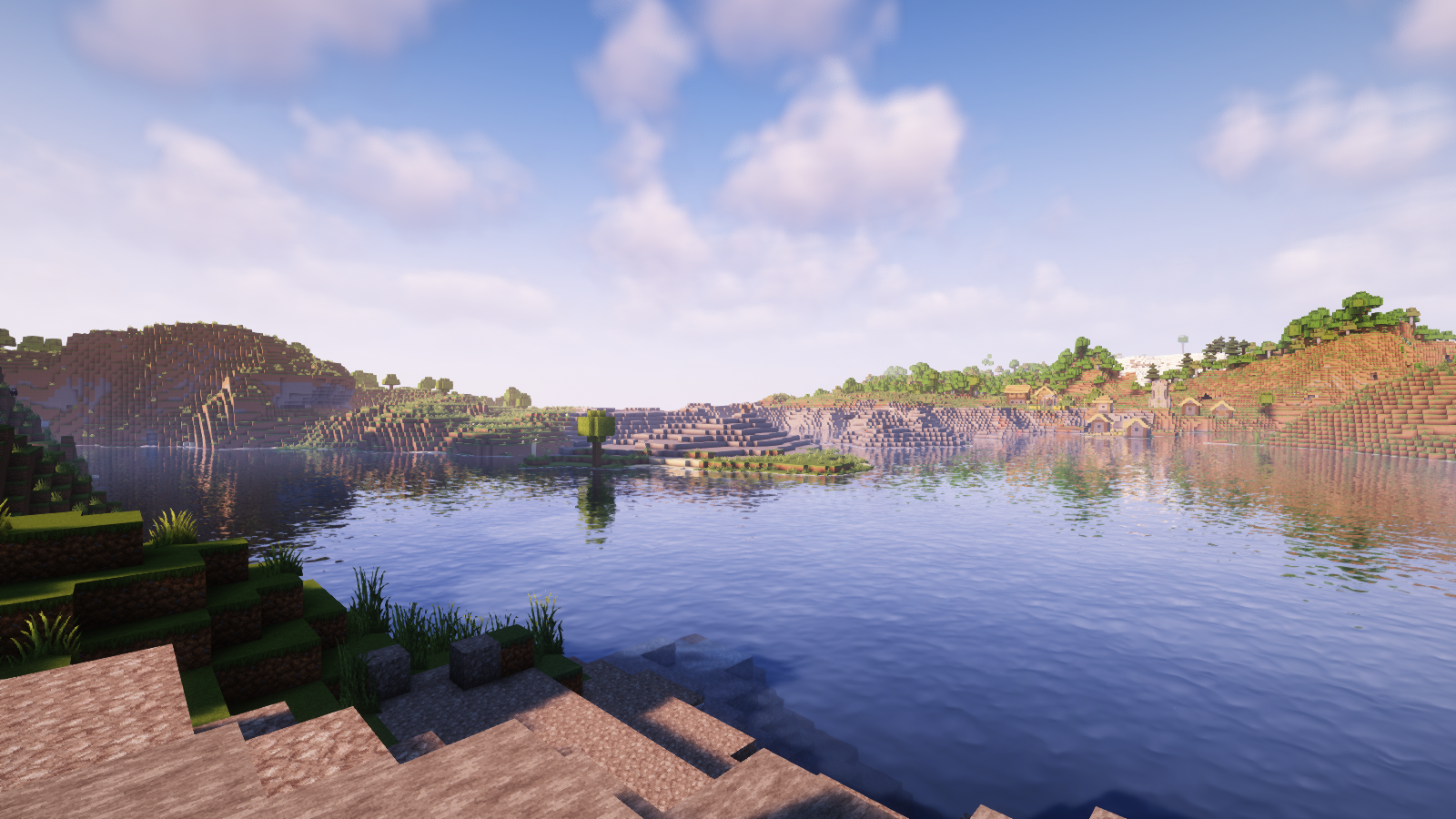 A screenshot of the lake opposite a lakeside village.
Screenshot taken using Faithful resource pack and Complimentary Reimaged shaders.