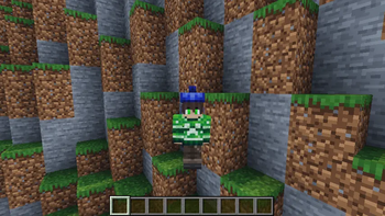 blue winter hat and green sweater