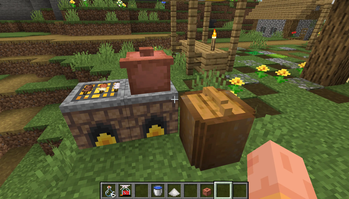 Lit stove with barbecue, pot and fermenter