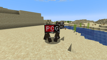 The PC Gamer Cow, in a desert