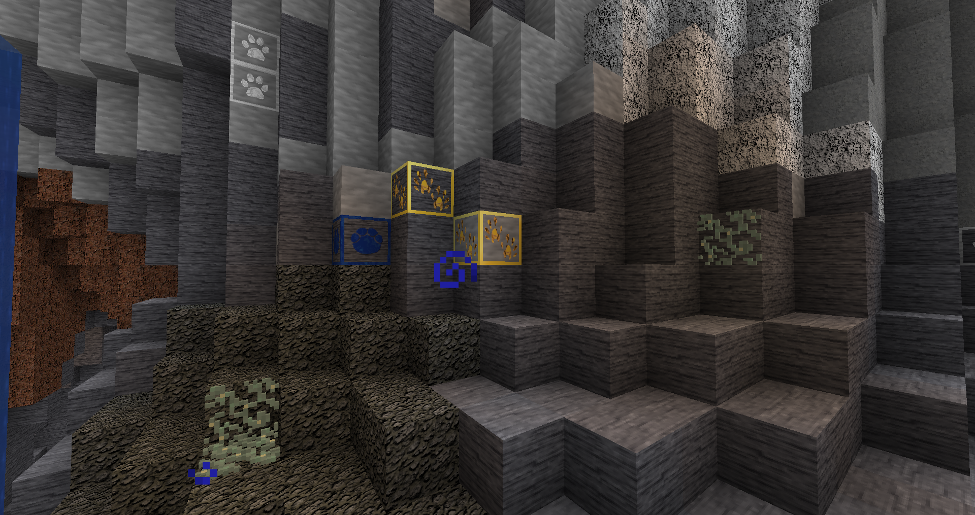 Photo of some blocks in a cave focusing on the look of the Iron, Gold, and Lapis Ores.