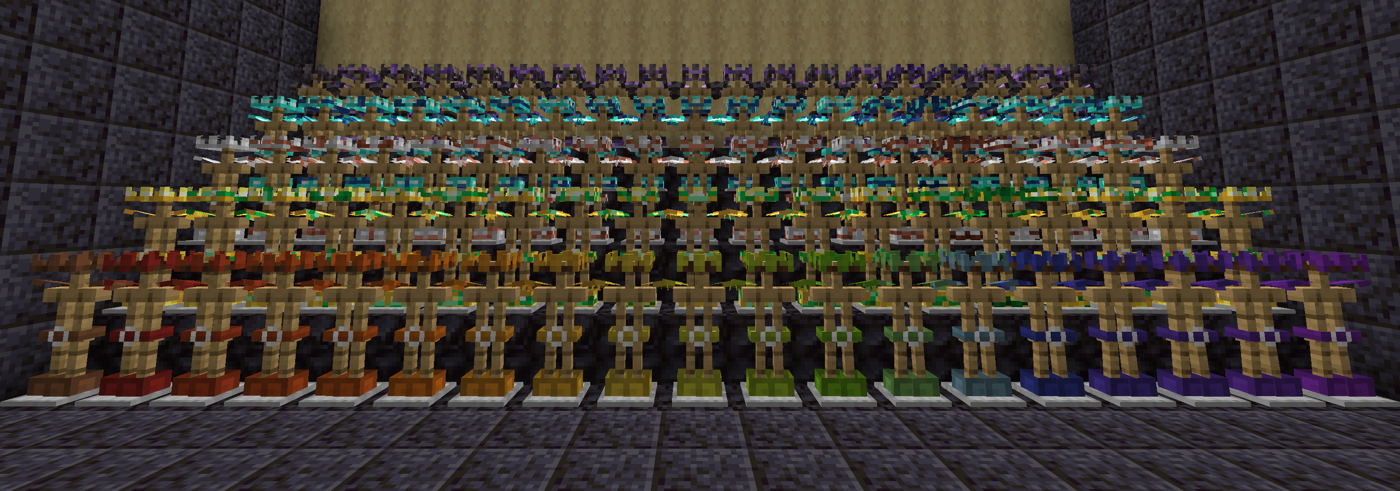 5 rows and 19 columns of armor stands. From the bottom, each row is a different armor type: leather, gold, iron, diamond, and netherite. The leftmost column is the regular armor, then each of the remaining columns is a different one of the 18 armor trims. The bottom row with the leather armor has a rainbow sequence of dye colors instead of trims.