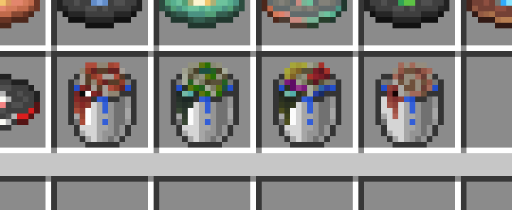 An image with three different buckets in the creative inventory: a bucket of nautilus, a bucket of zombie nautilus, a bucket of coral zombie nautilus, and a bucket of baby nautilus