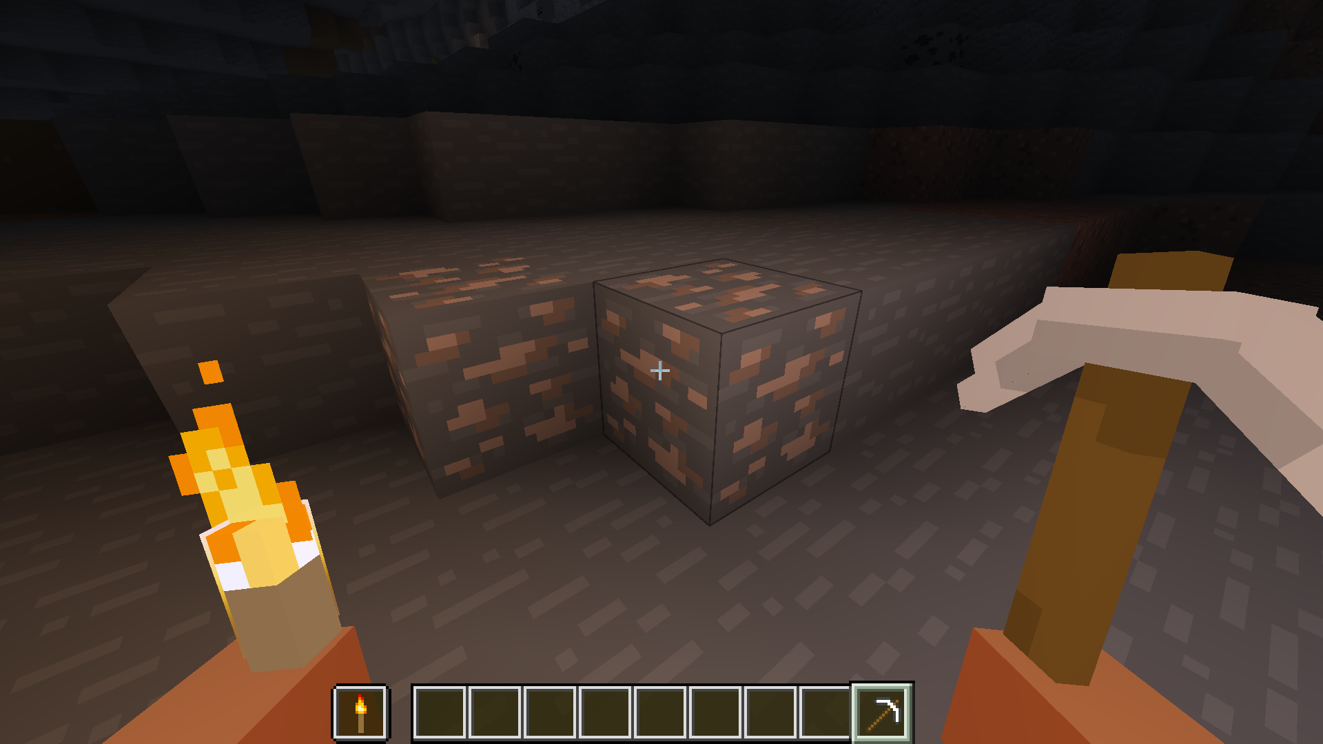 player holding a 3D iron pickaxe and torch