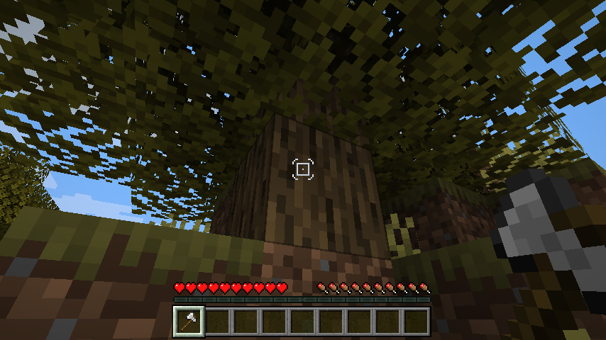Facing a log, wielding an axe, in the default configuration.