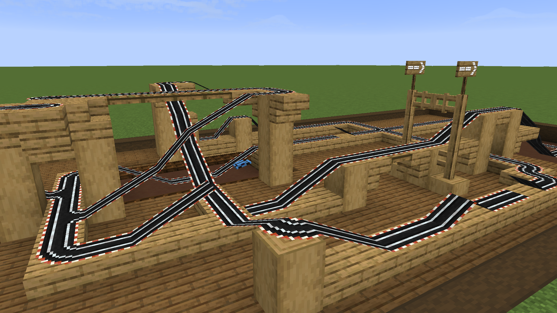 A slot car track with a car doing a jump