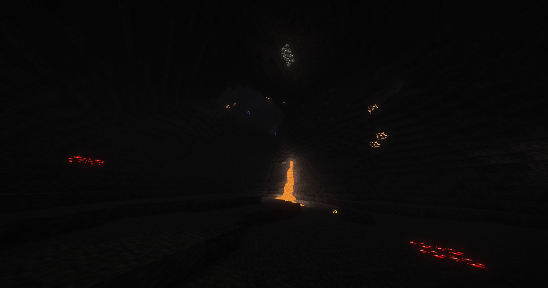A cave with various types or ores and some lava. Taken with the Emissive Ores resource pack and Complementary Shaders.