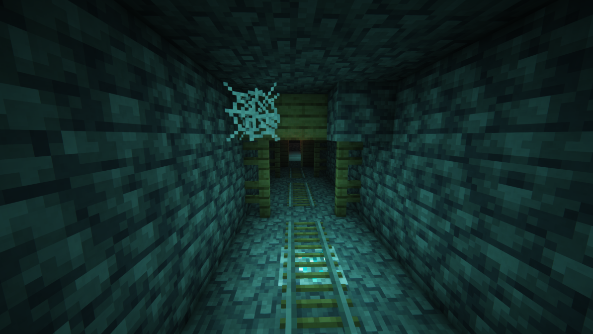 A mineshaft with a diamond ore under the rails.