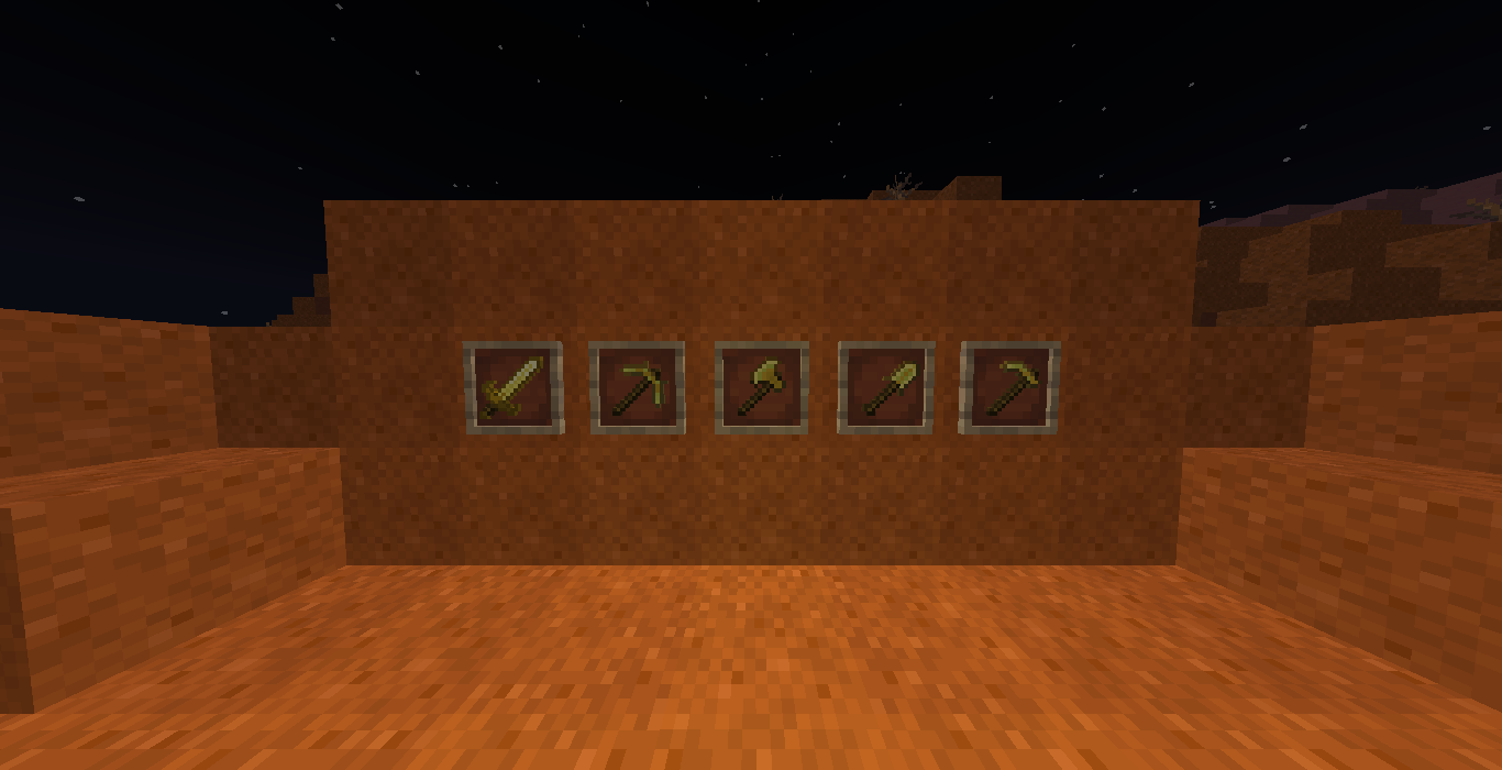 The Reinforced Gold Tools inside of a badlands biome at night