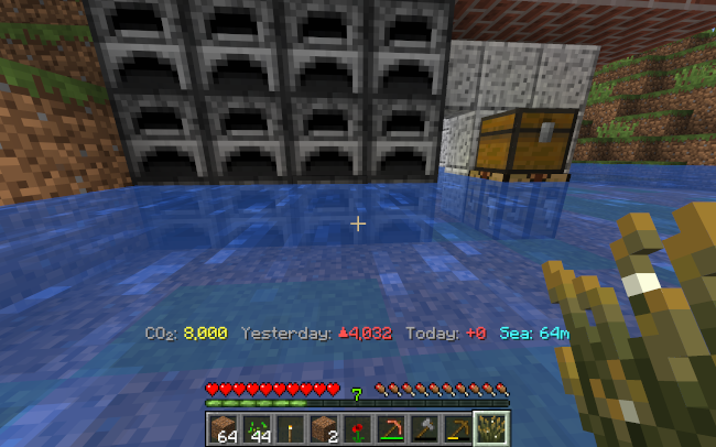 A wall of furnaces outside a house that has been flooded by sea level rise