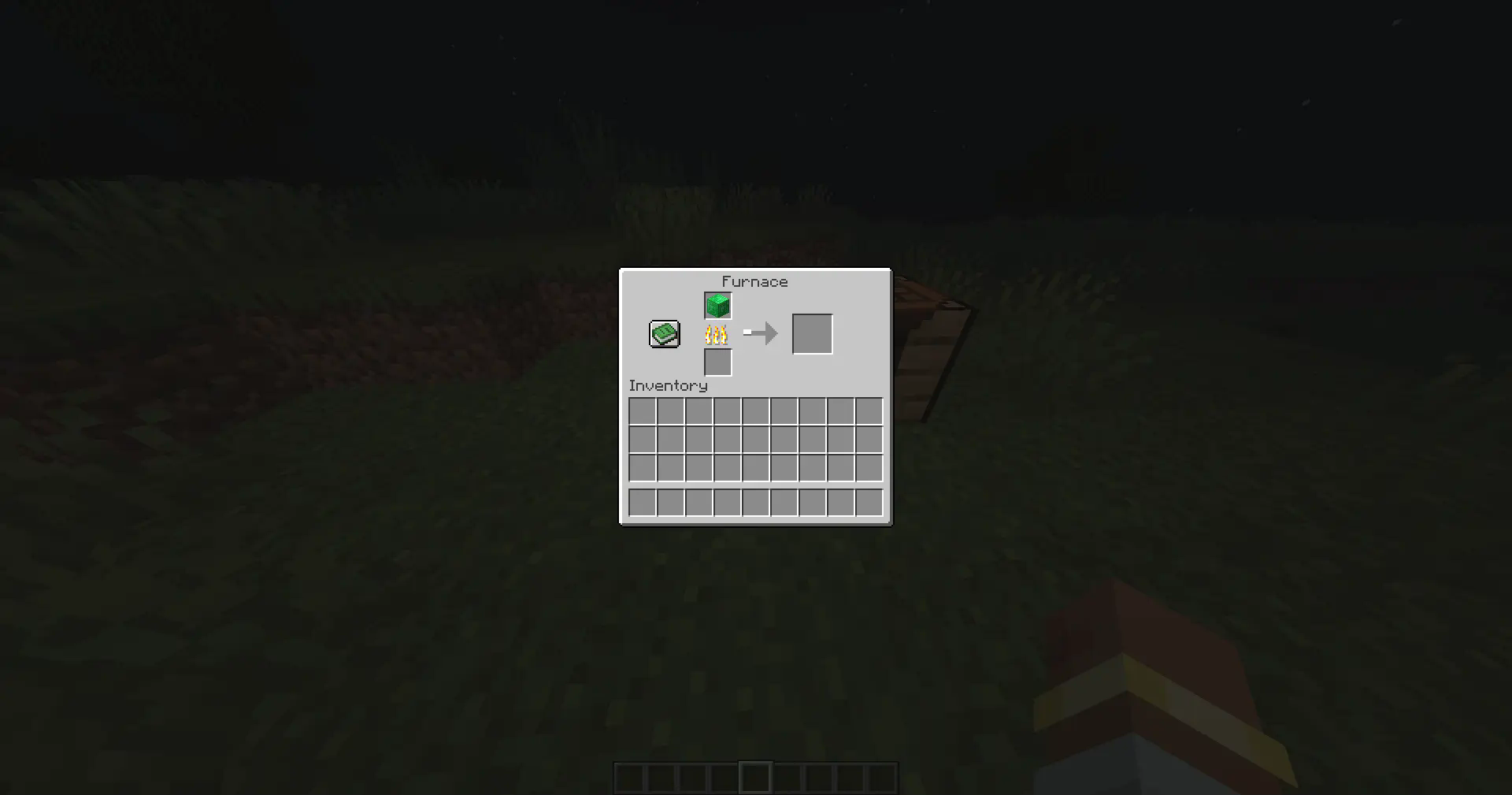 An emerald block gets placed into a lit furnace