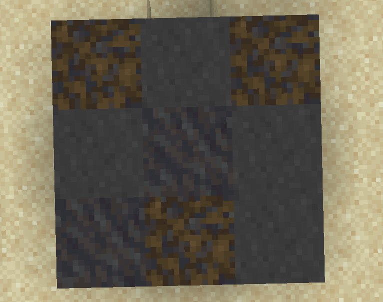 Black Stained Clay blending amongst some mud blocks