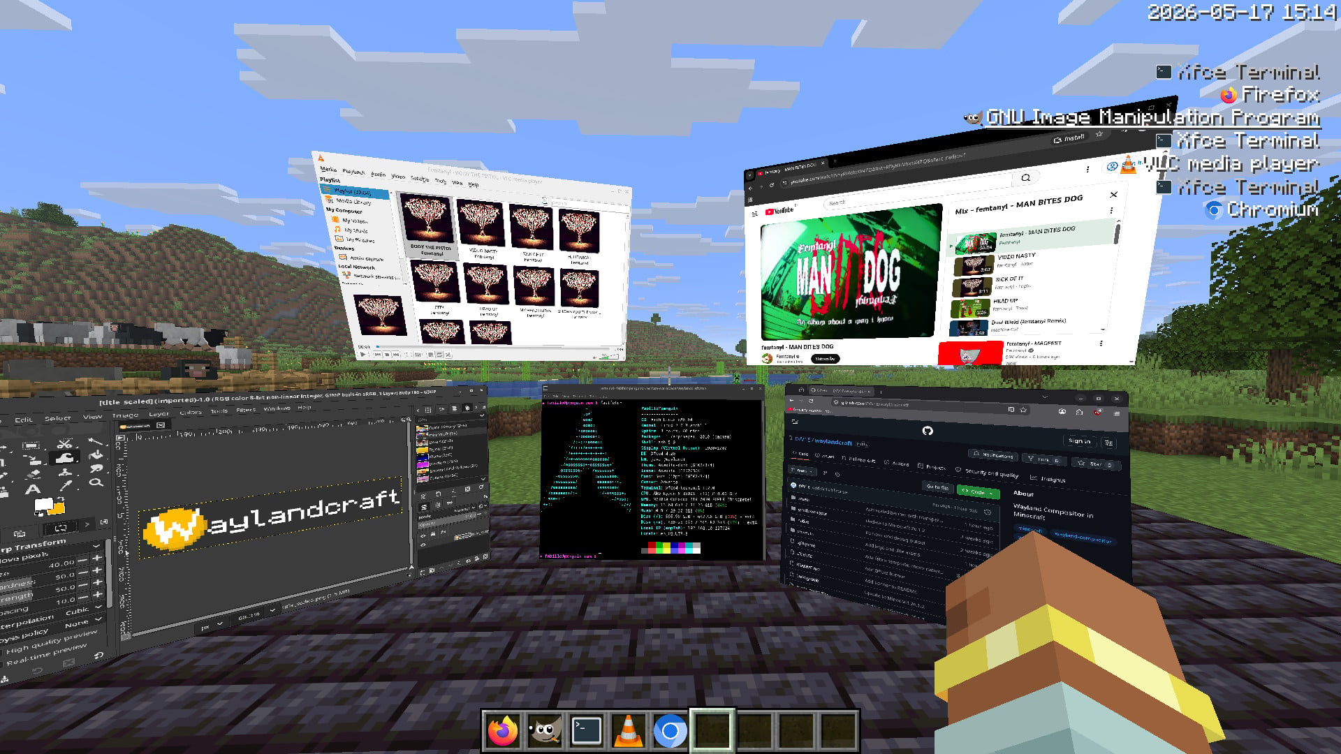 Screenshot in-game of a variety of open windows including Firefox, GIMP and VLC