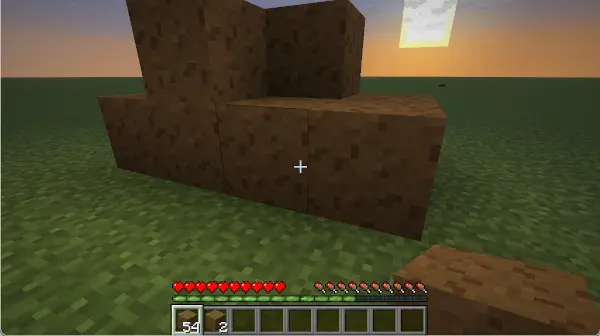A sunset scene with several blocks of dried manure