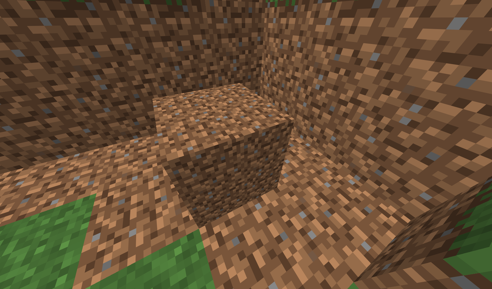 A close-up first-person view of a manually placed Dirt Dirt block in Minecraft. The camera looks downward into a small, irregular cavity filled with vanila dirt blocks. One block protrudes near the center, clearly displaying the mod’s detailed 32×32 dirt texture on its top and sides. The surrounding walls and floor are made from vanila dirt, while small patches of green grass are visible around the upper and lower edges. No player interface is shown.