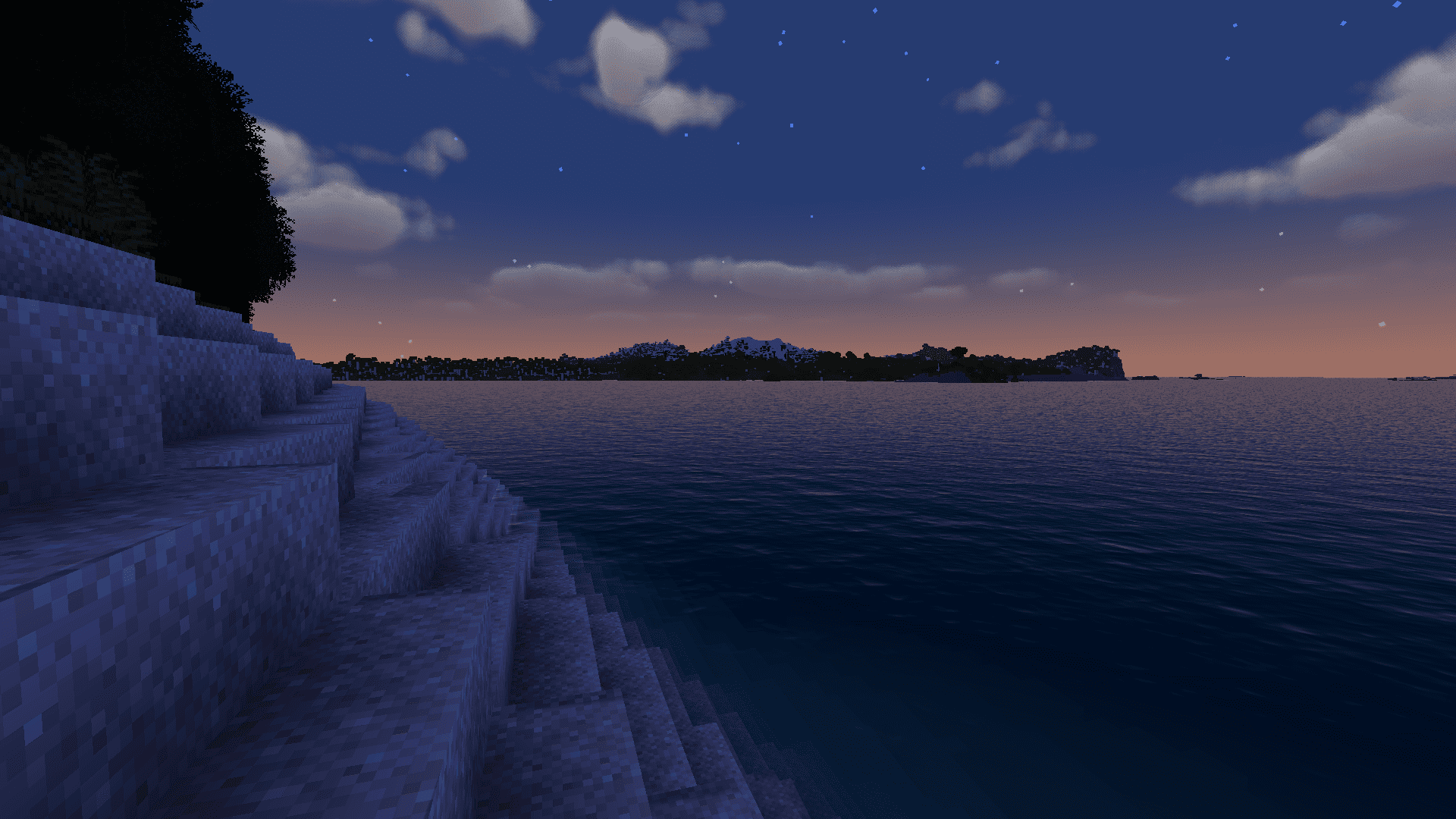 The landscape shows a beach at sunset with the ocean in the background.