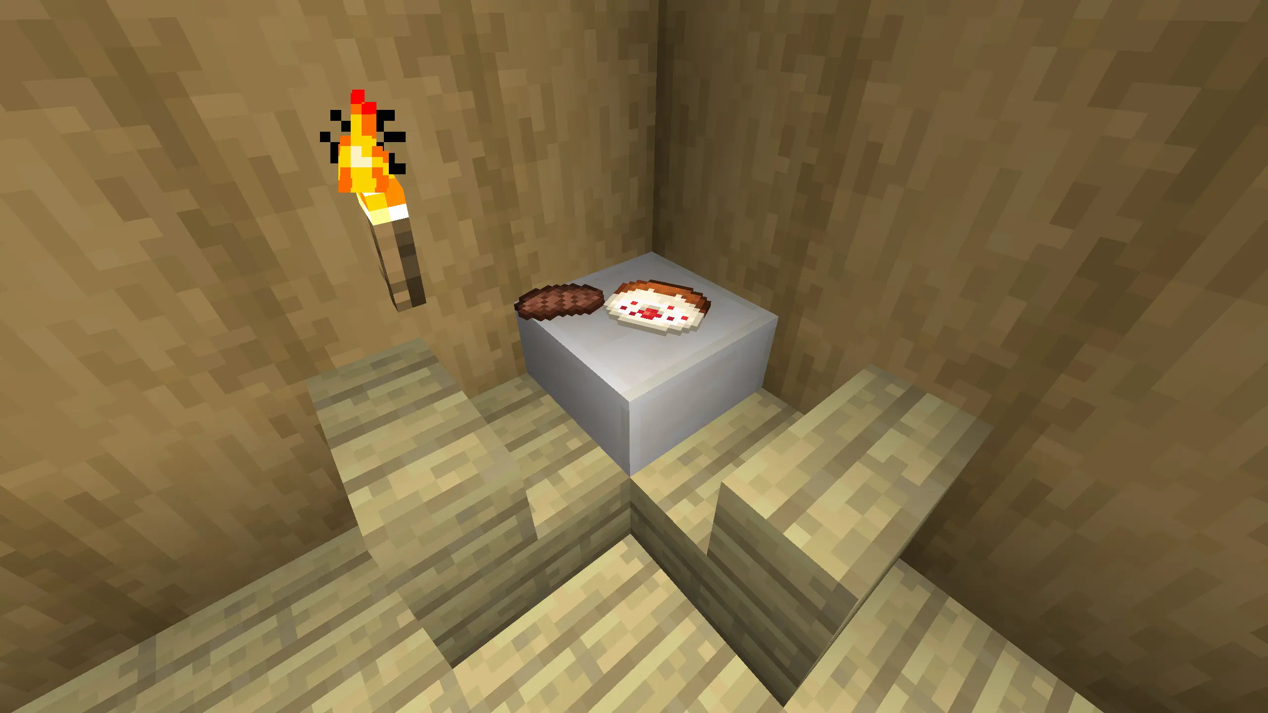 a cake and steak on the dining tabe