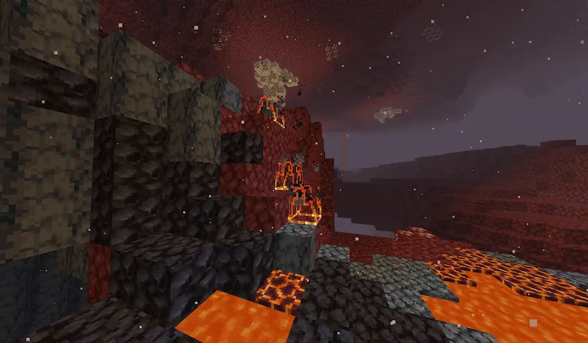 A few hollowed fires, in the nether, on a hill, next to lava