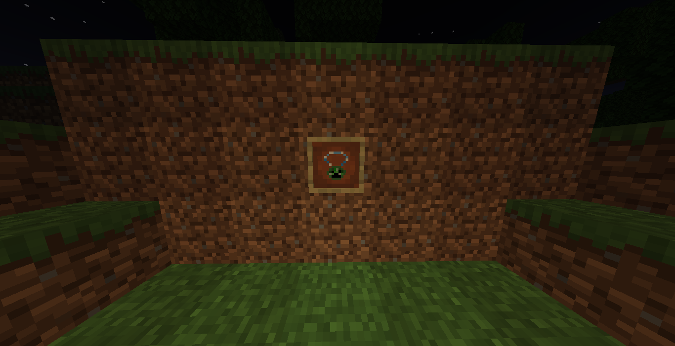 The Creeper Charm in an item frame at night