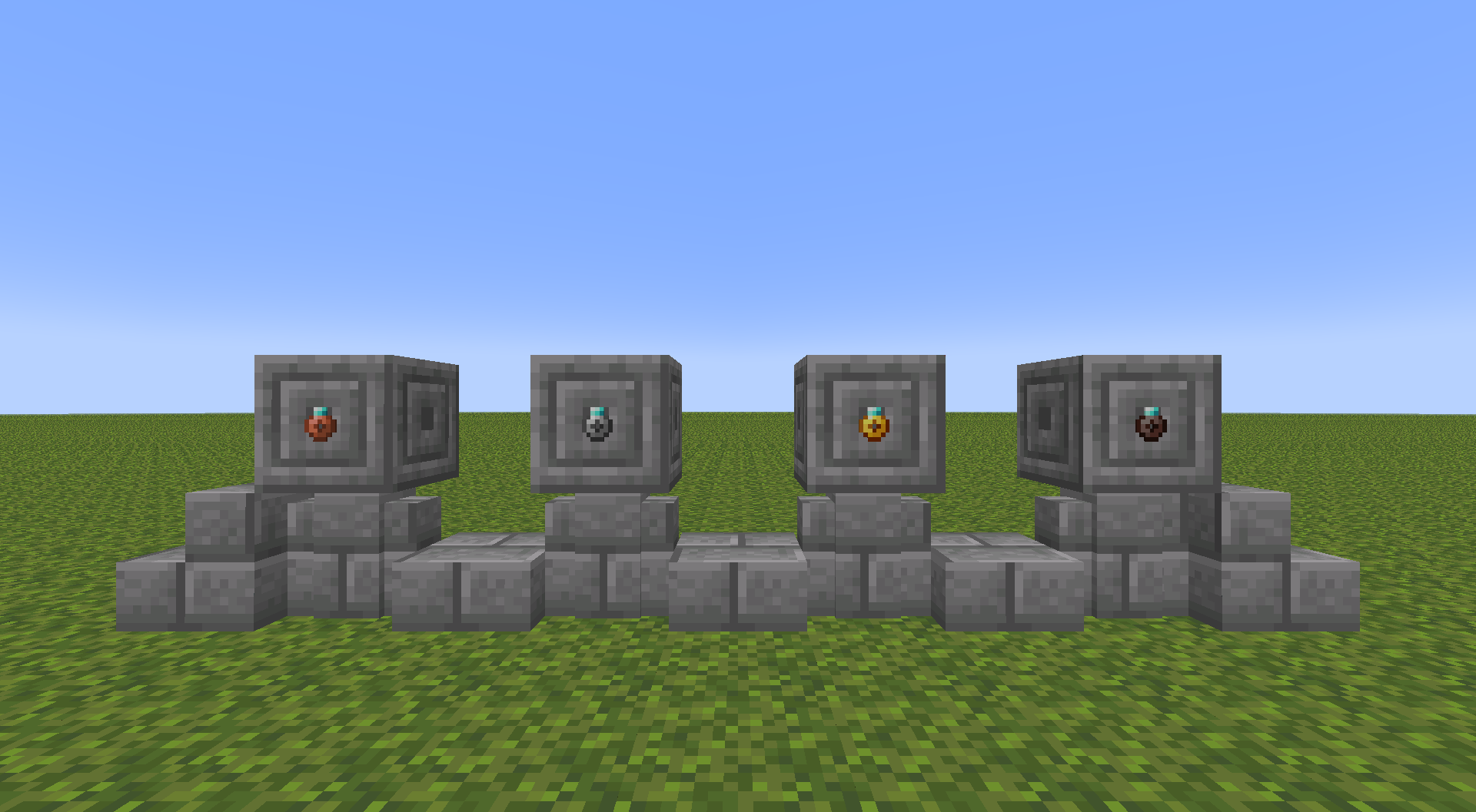 All four ring metal types sitting on stone pillars