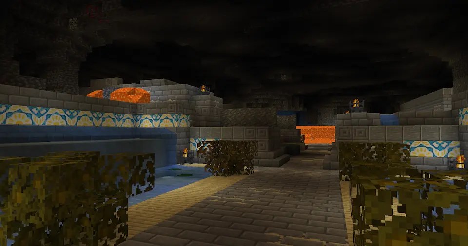 A room with two walls of water and bushes growing on the sides.