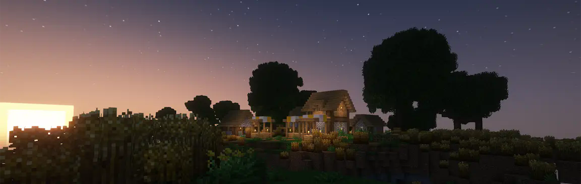 A village house in a field of wheat at sunset.