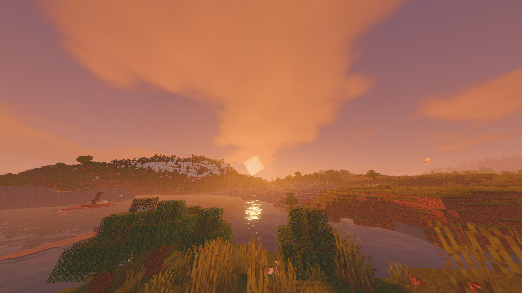 A beautiful stunning sunset, with atmospheric fog, cloud color tint, godrays, and reflective water.