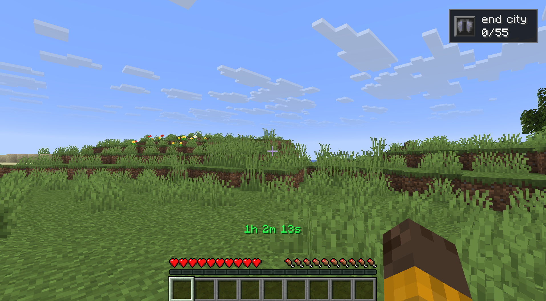 A first-person view in Minecraft shows a grassy field under a bright blue sky with scattered block-shaped clouds. The player has empty hands and a full health bar, and a timer on the screen says “1h 2m 13s.” In the top-right corner, there is a challenge progress box labeled “end city 0/55.”