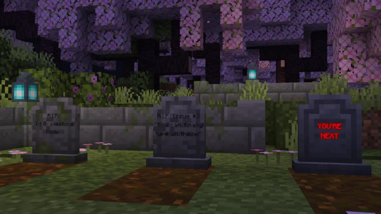 A screenshot of 3 aesthetic gravestones in a cherry grove surrounded by ruins. The grave on the left reads "R.I.P. Old Gravestone Model". The grave in the middle reads "R.I.P. Issue #3. You can finally type on these!". The grave on the right reads "YOU'RE NEXT", and is dyed red and glowing