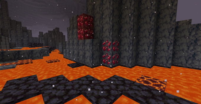 Ruby ores. Two embedded in basalt. Two embedded in netherrack. Surrounded by lava.