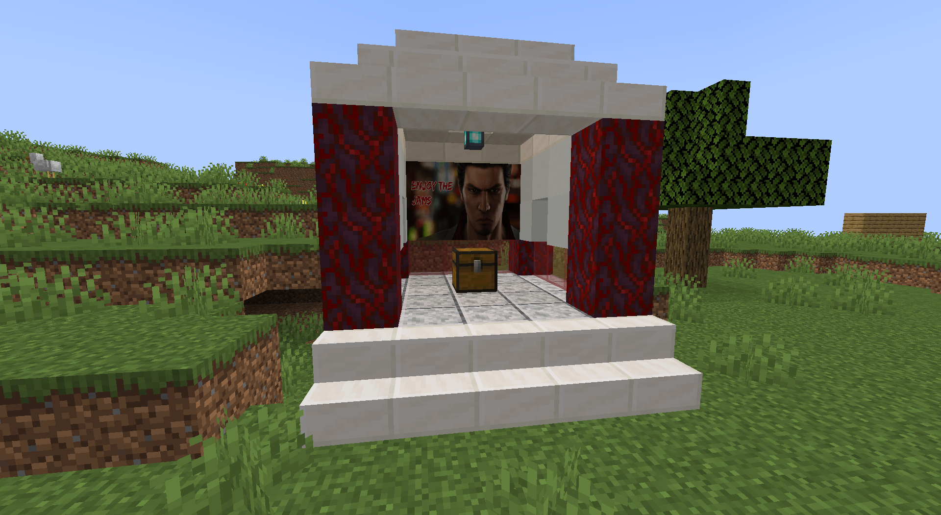 Structure featuring a chest and a painting of Kiryu Kazuma saying "ENJOY THE JAMS"