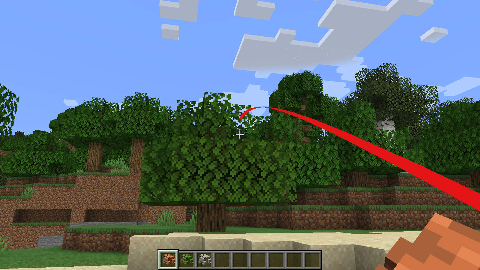 A Handheld Frog being used to pull a Diamond Pickaxe from a tree.