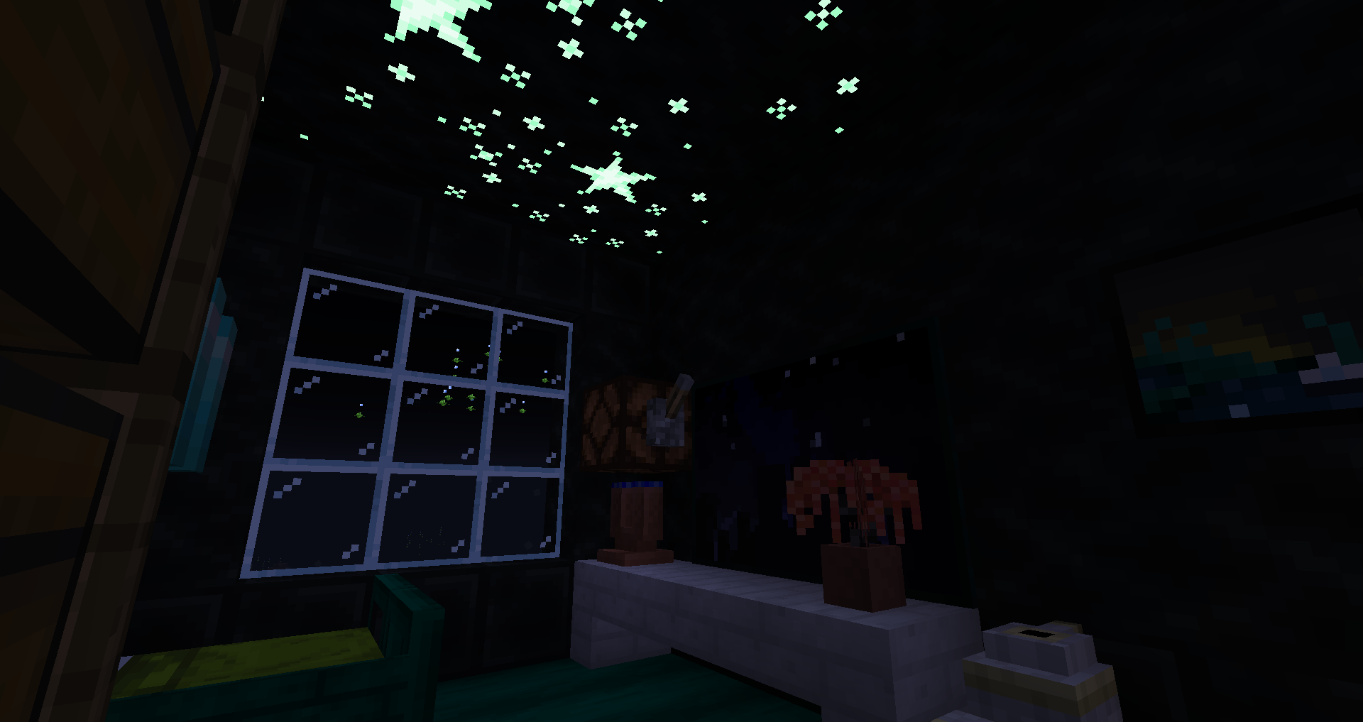 A dark room with glowing stars on the ceiling.