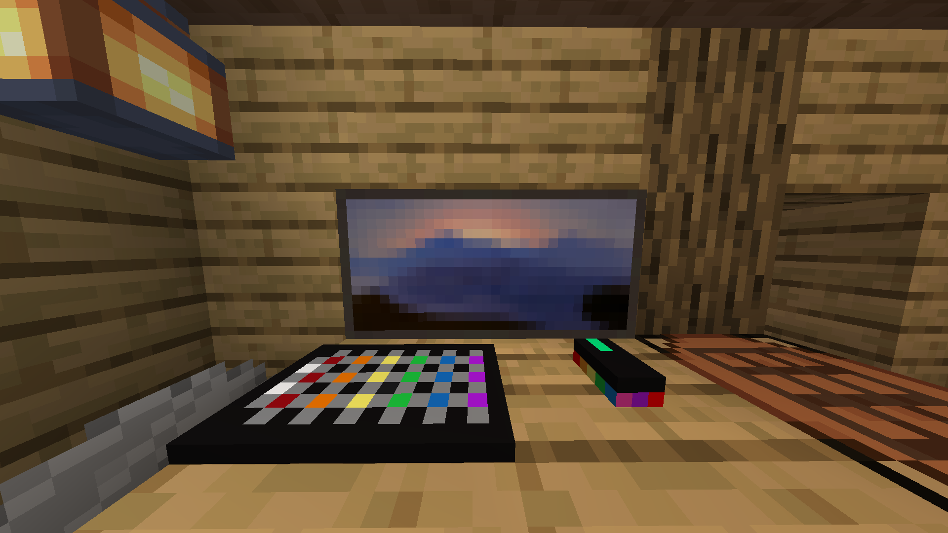A square, black keyboard with RGB Lights and a rectangular black mouse with RGB Lights on the bottom.