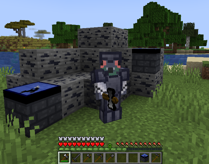 Player around a bunch of tungsten-related blocks with full tungsten gear