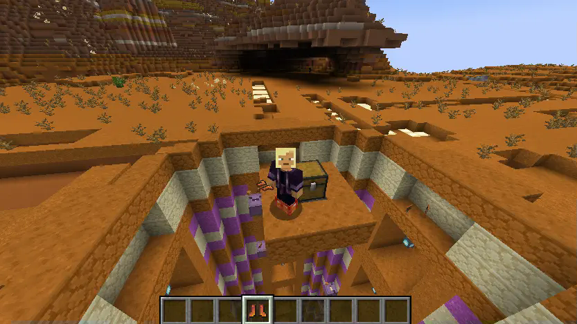 Image of a player with long fall boots in their hotbar and on their feet, taken at the top of a long fall dungeon