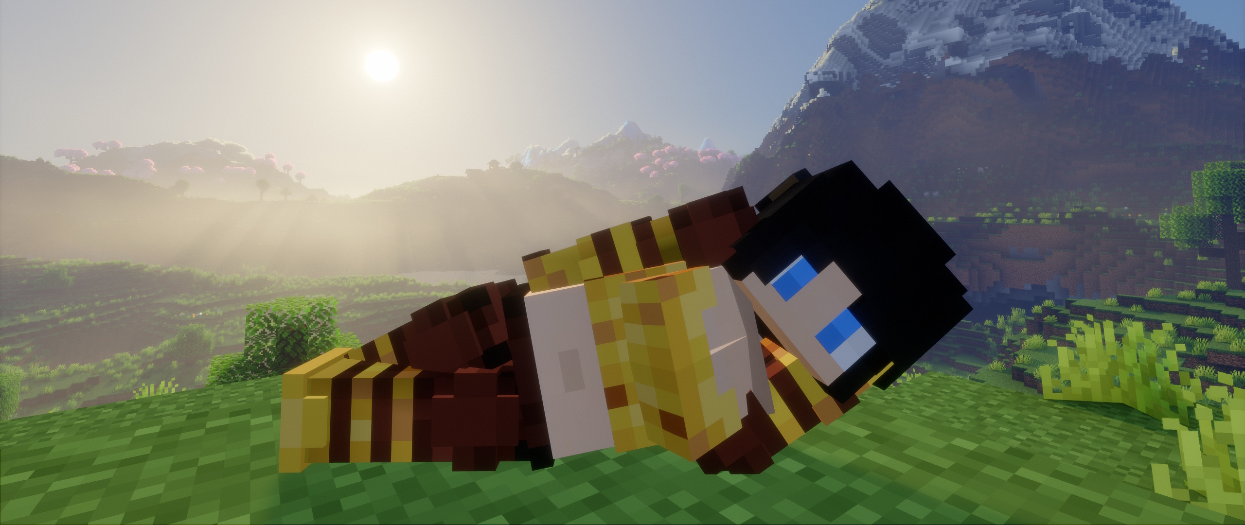 A Minecraft player laying on the side on a hill.